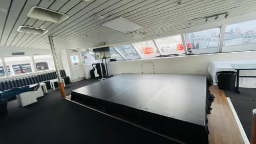 A stage hired and set up inside of a large boat