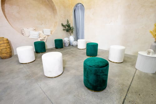 White and green velvet ottomans tools