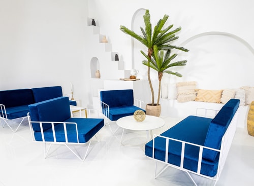 Wire sofa armchairs with navy blue velvet cushions