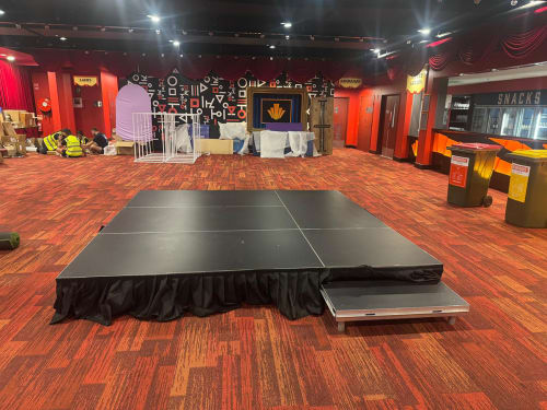 A small black stage at an event
