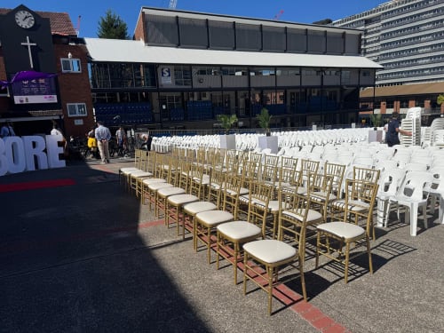 Lots of chairs set up for a speaking event in front of the church