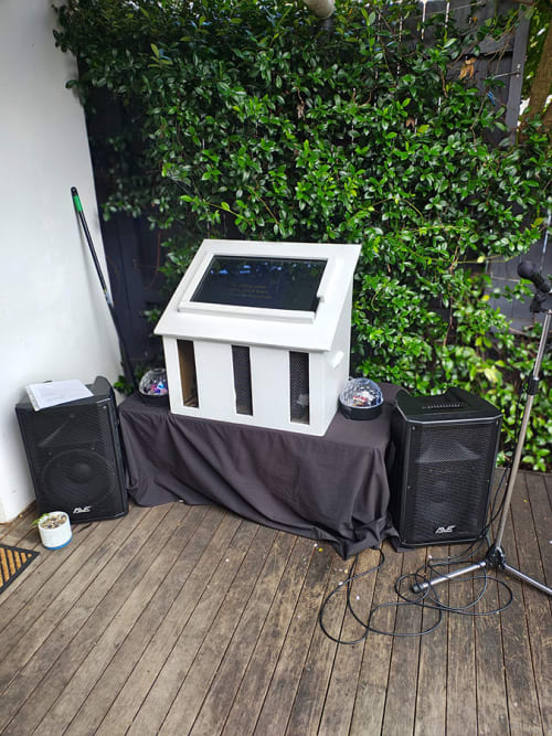 A karaoke machine ready for use at an outdoor party