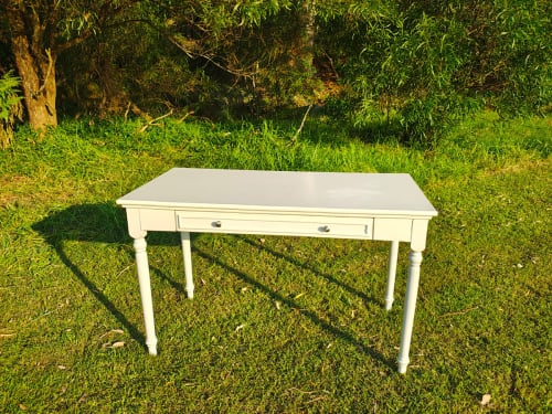 Our white wooden signing table on the grass at a park