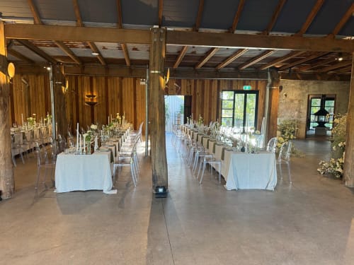 Victorian ghost chairs and tables set up for a wedding reception