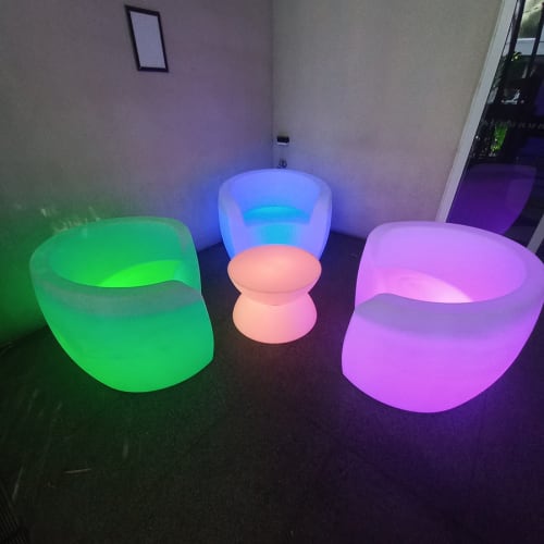 Three glow lounges surrounding a small glow table