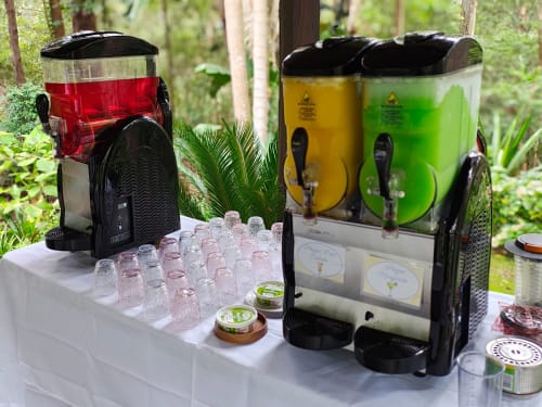 A single and double slushy machine set up and ready for use