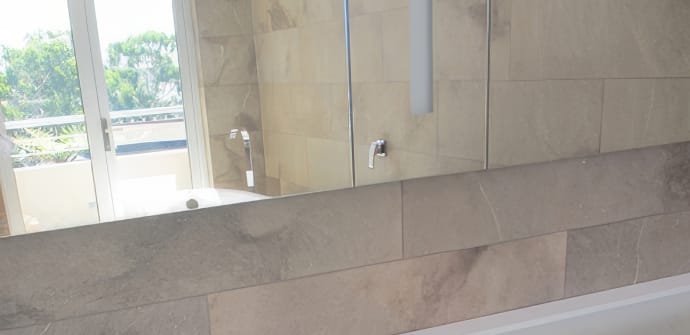 A new bathroom mirror installed by Palmers Glass