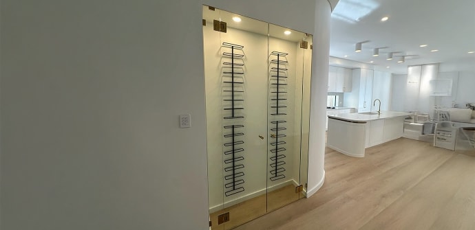 A residential wine display with beautiful glass doors