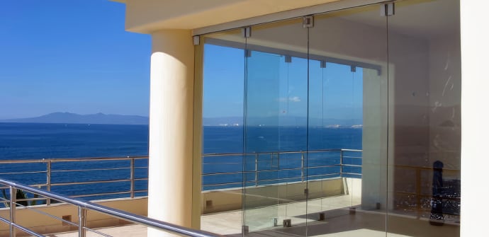 New glass doors installed on a waterfront home