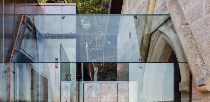 A glass hallway with a glass roof on a church