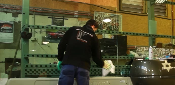 A Palmers Glass worker handling custom cut glass