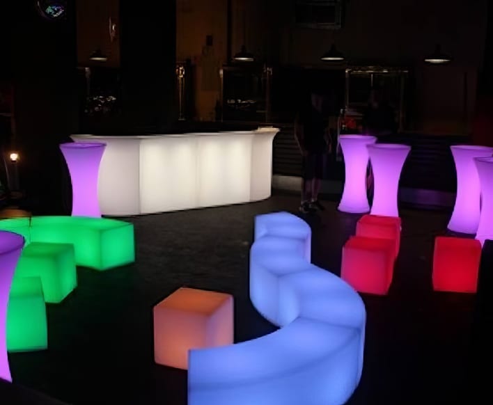 A bar with colorful cubes and stools.