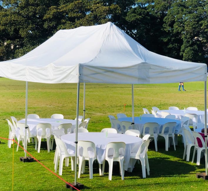 Pop up Marquee with White Plastic Chairs