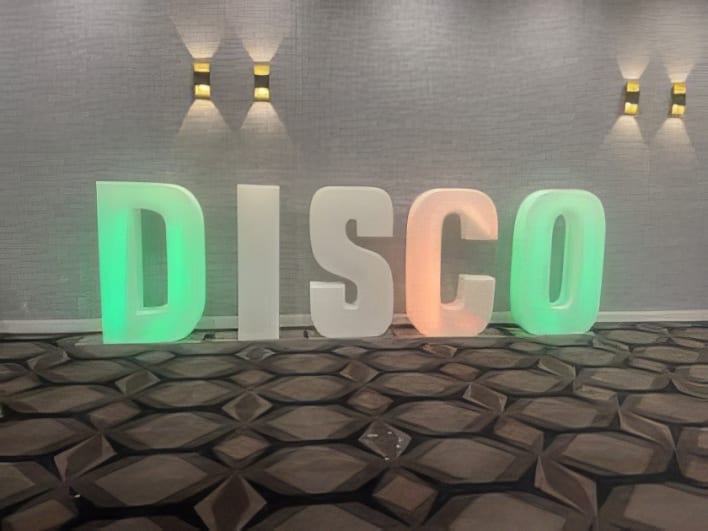 Glow letters that spell disco