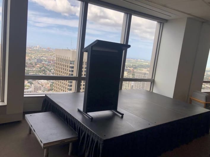 A podium in an office with a view of the city.