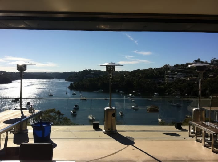 A view of the water from an outdoor patio.