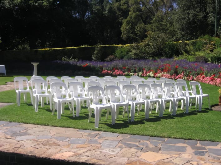 White plastic chairs being hired in Bonnet Bay