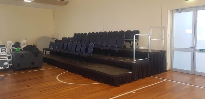 Black padded chairs hired for an event