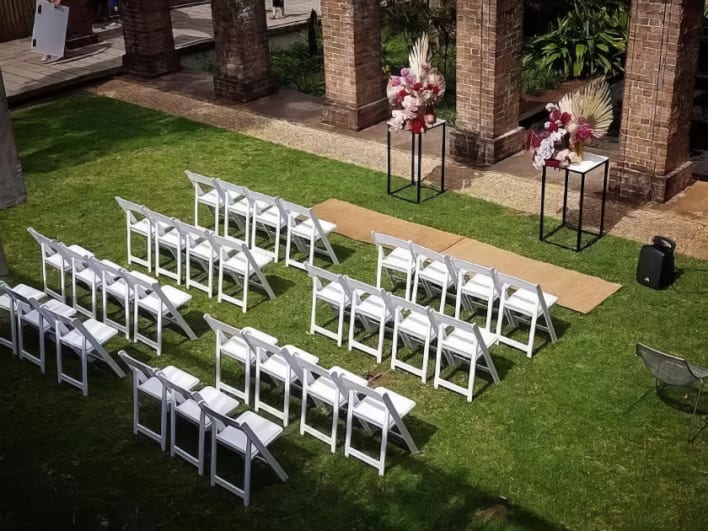 White chairs being hired for a wedding ceremony in Bass Hill