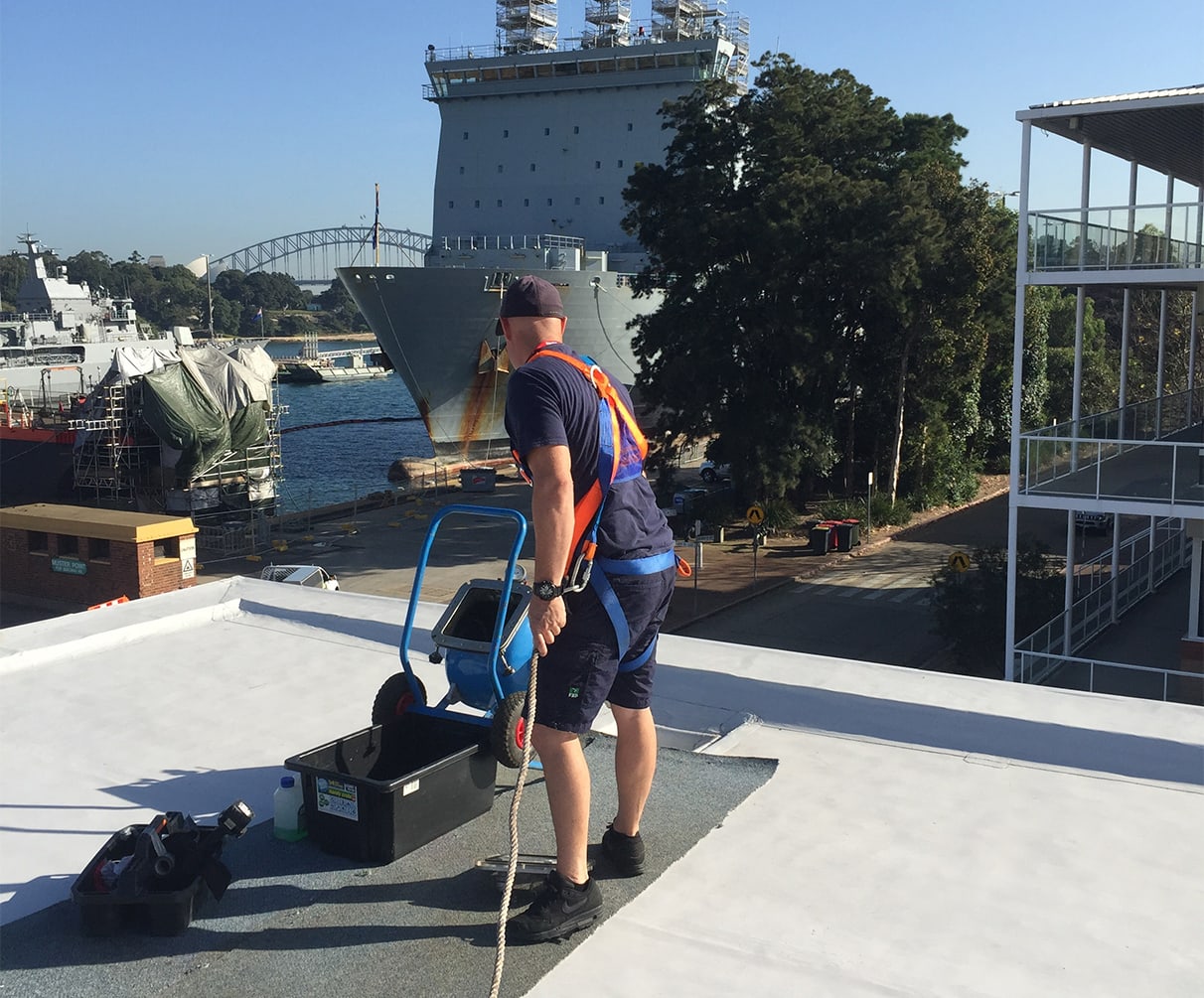 Pipe relining on a roof near the water