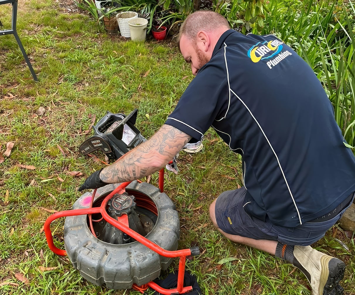 One of our friendly plumbers unblocking a drain in Allambie Heights