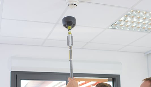 A smoke alarm being tested