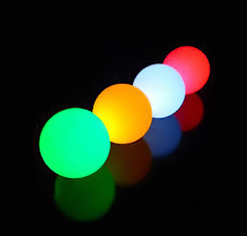 A row of colorful 40cm glow spheres on a black background.