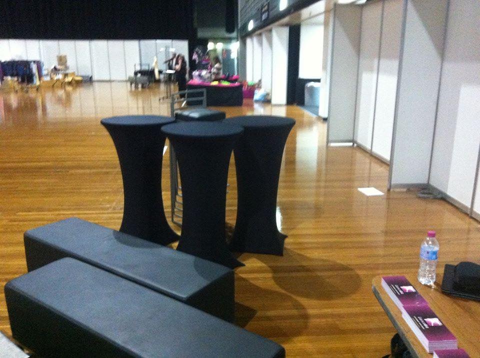 A black table and chairs in a room.