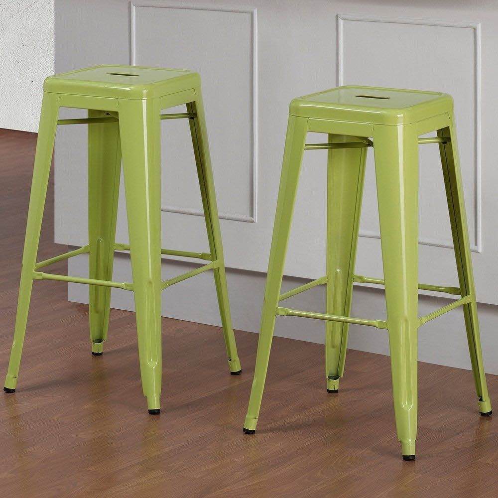 Two lime green metal bar stools in a kitchen.