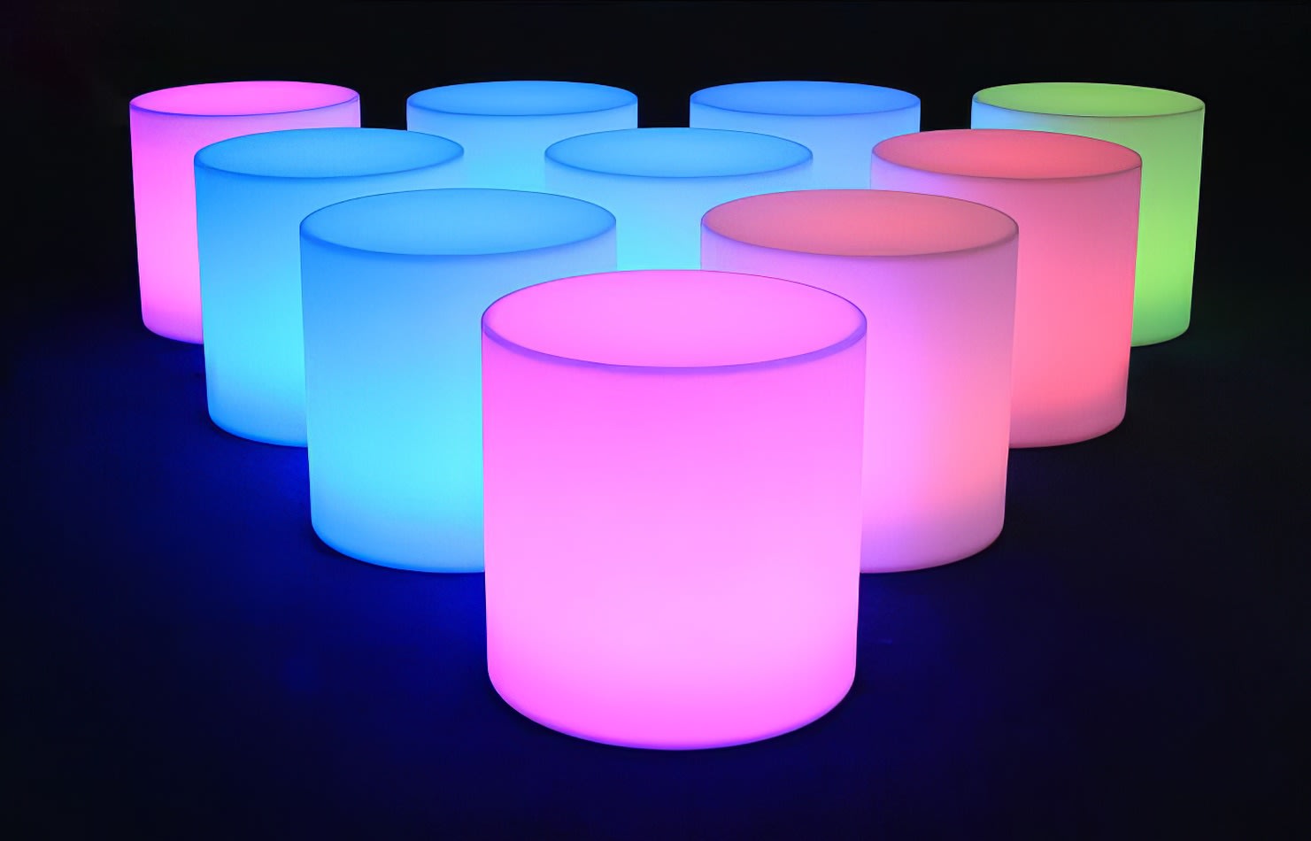 A set of colorful glow cylinders on a black background.