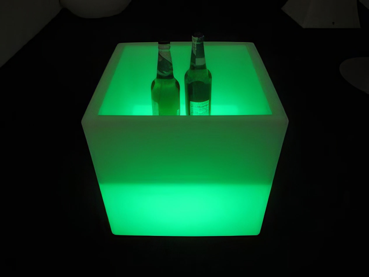 A glowing cube with two bottles inside for hire.