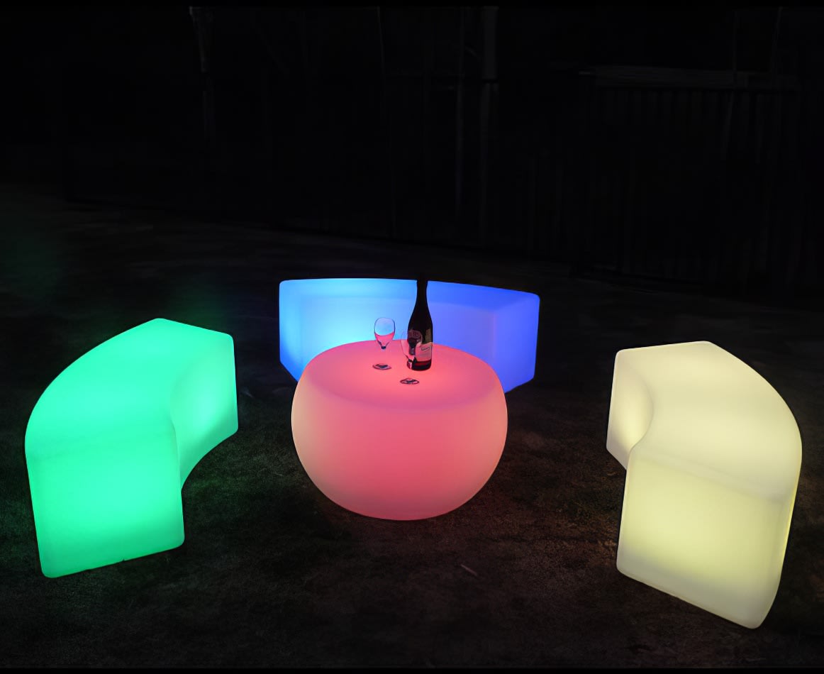 A set of colorful LED stools and a bottle of wine perfect for Glow Bench Hire events.