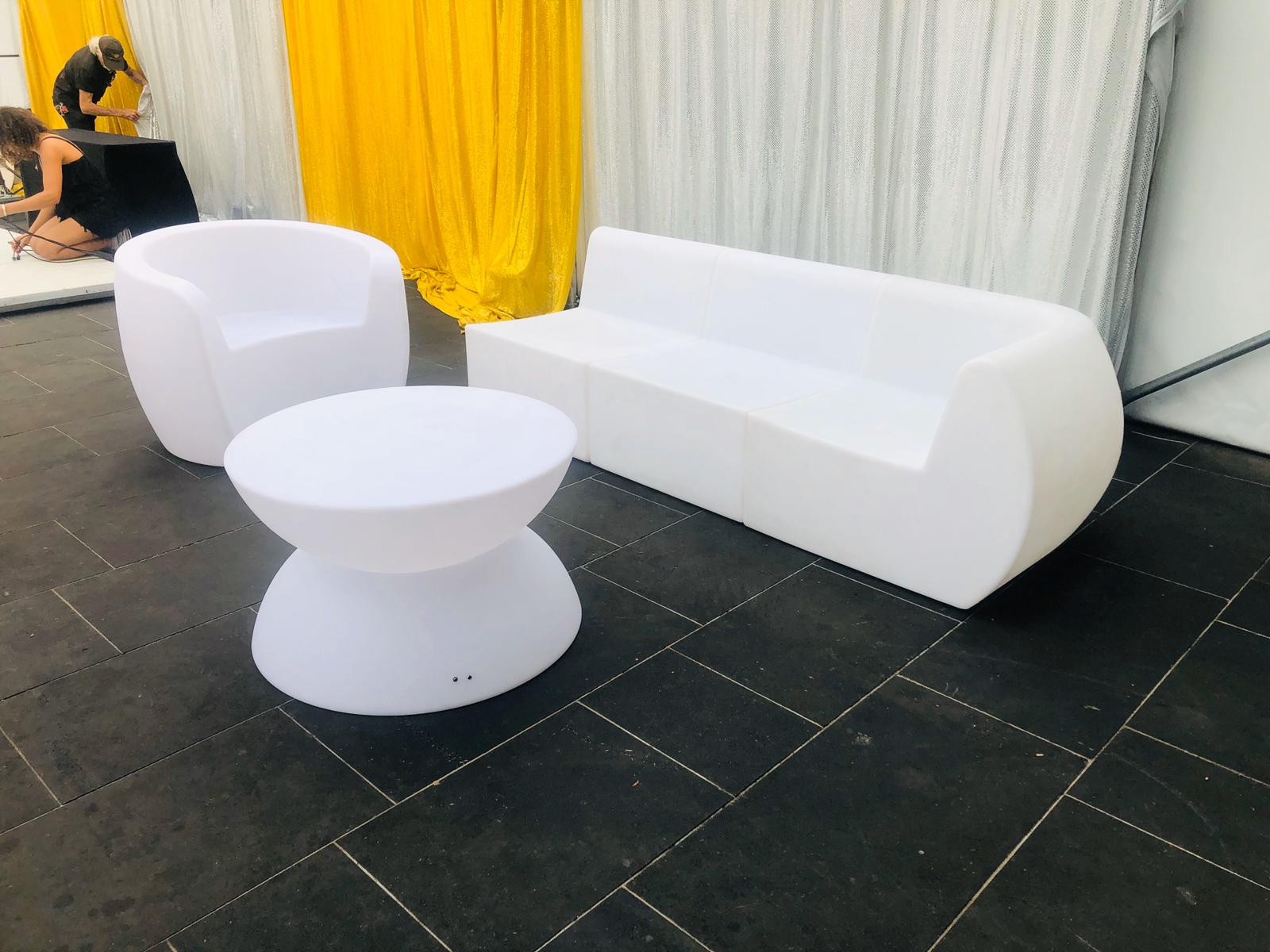 Glow Couch Hire: Transform your room with a stunning white couch and table ensemble. Perfect for creating a sleek and modern aesthetic, this set will brighten up any space.