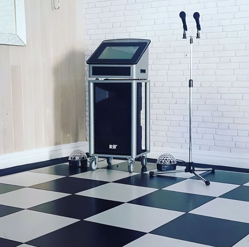 A black and white checkered floor with a karaoke machine available for hire.