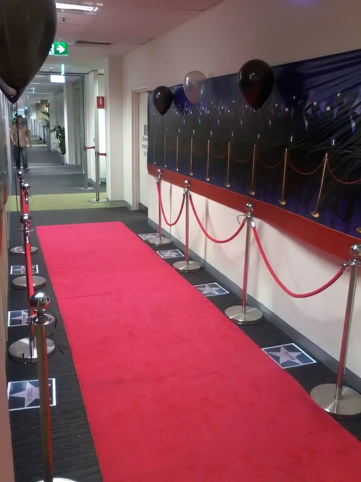 A hallway adorned with a luxurious red carpet hired for a stunning 3m length.