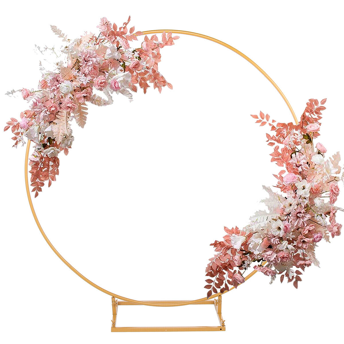 A gold hoop backdrop with flowers and leaves on it.