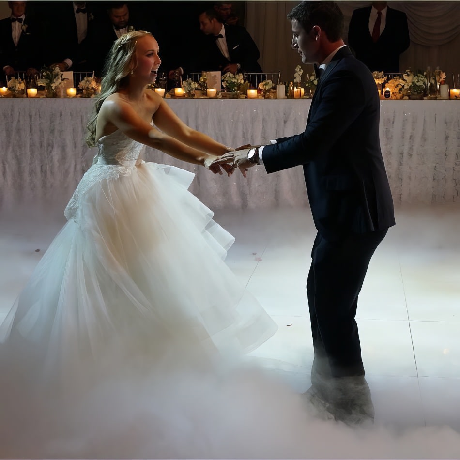 A bride and groom gracefully dancing in a magical cloud of smoke, created by a professional operator with a dry ice machine.