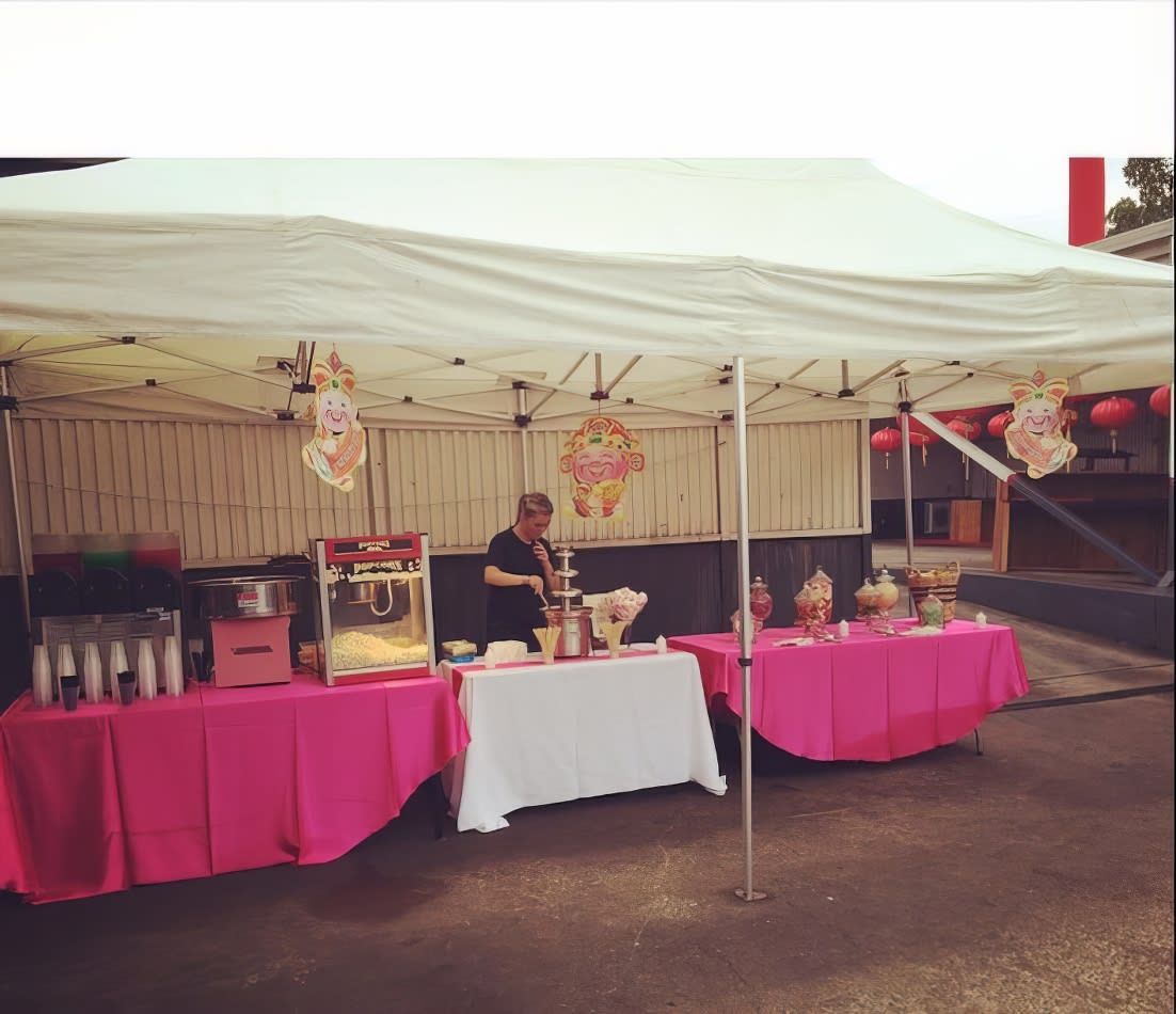 A pink tablecloth covers a pink table.