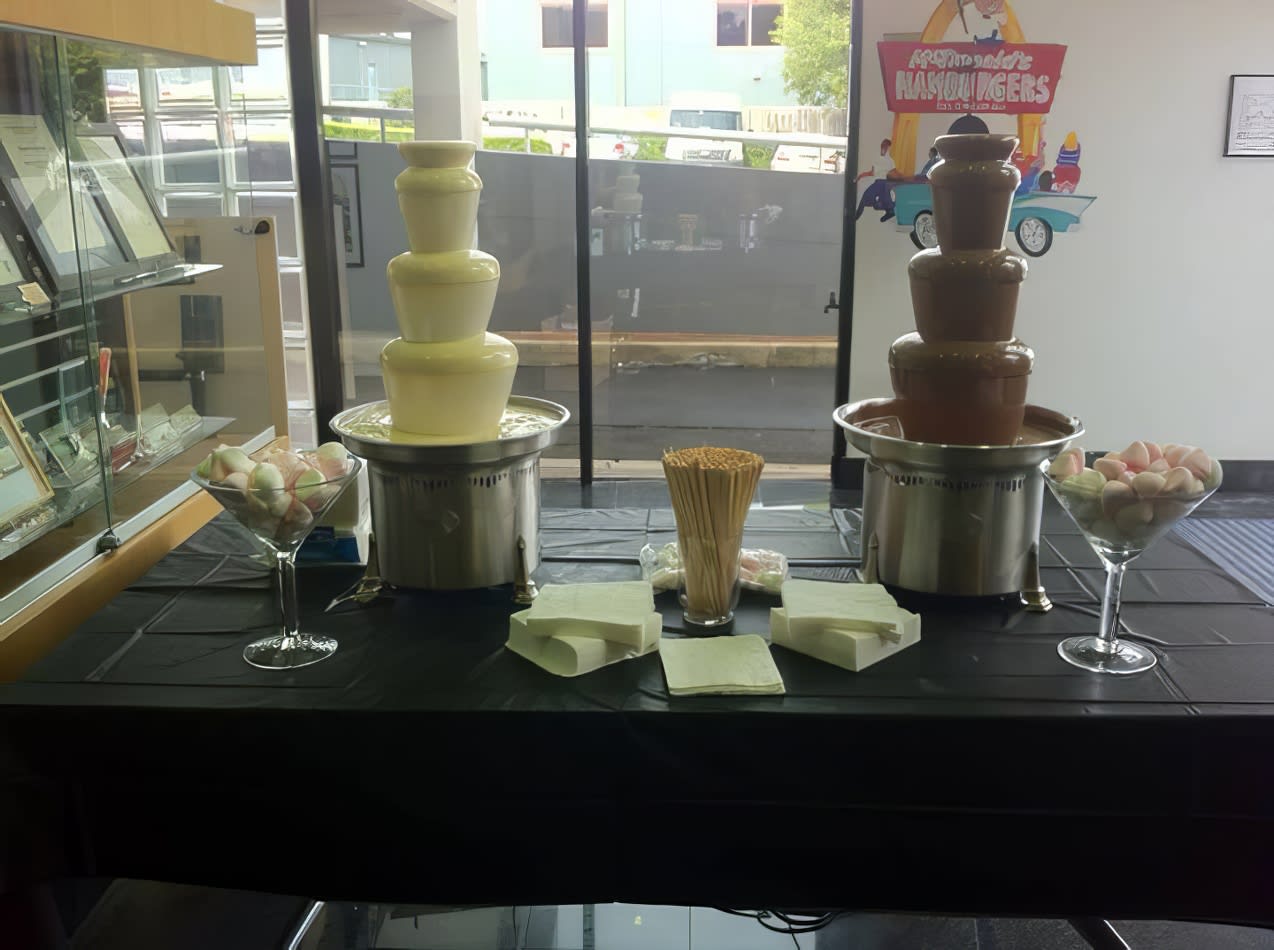 Package 3 includes a table with a chocolate fountain set up in front of it.