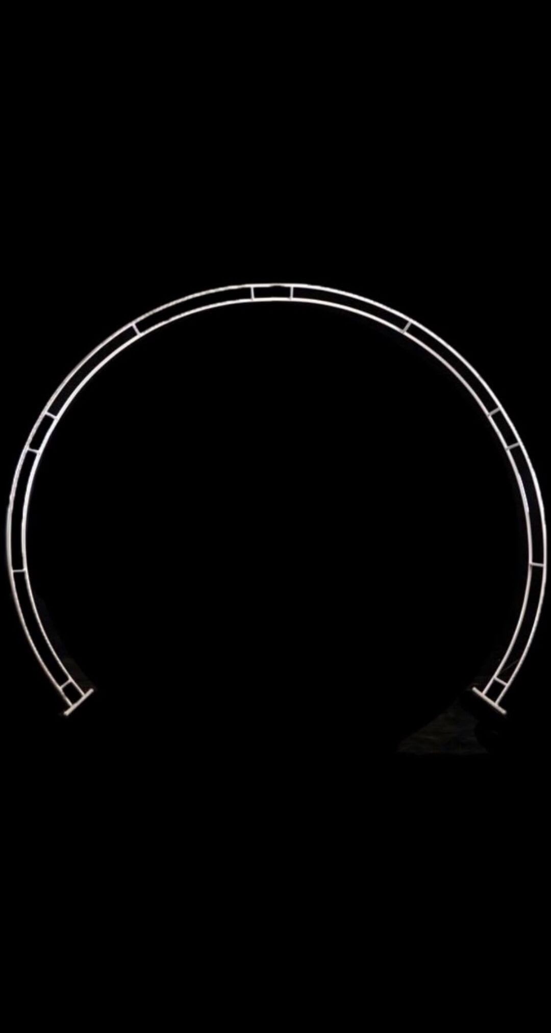 An image of a circular metal frame on a black background, perfect for Bridal Arch Hire.