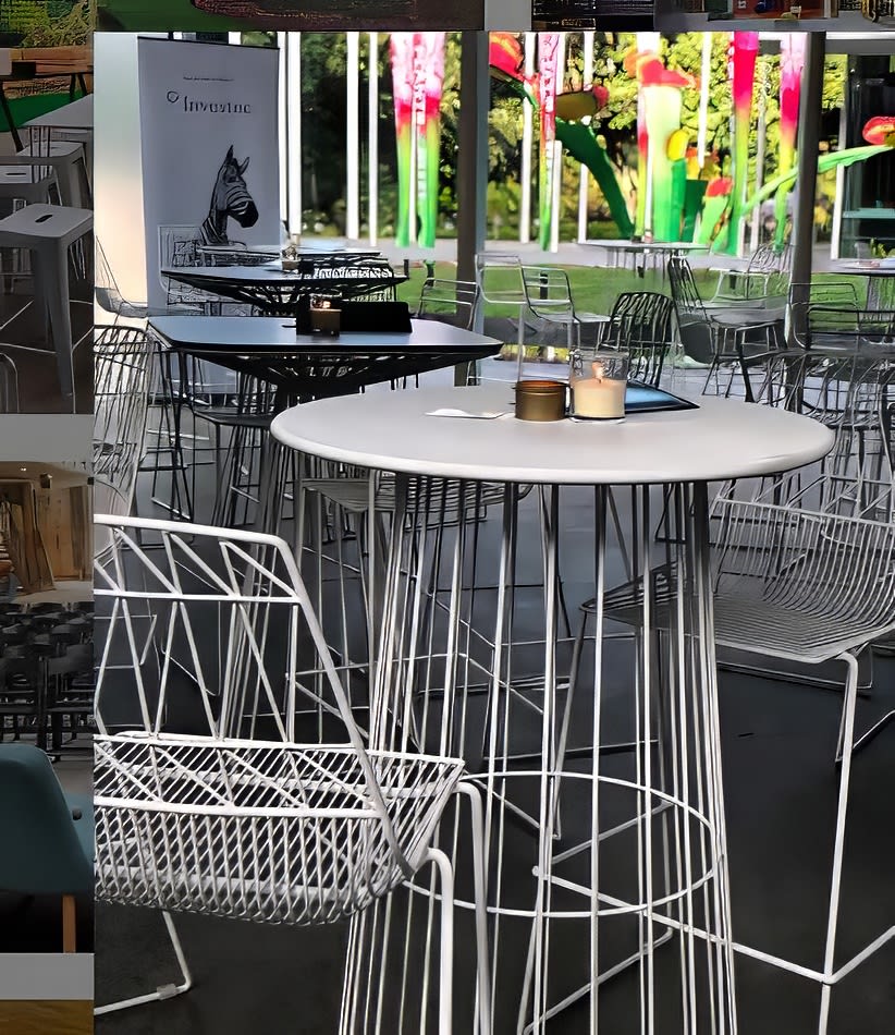 A group of tables and chairs in an outdoor area, including White Arrow Stool Hire.