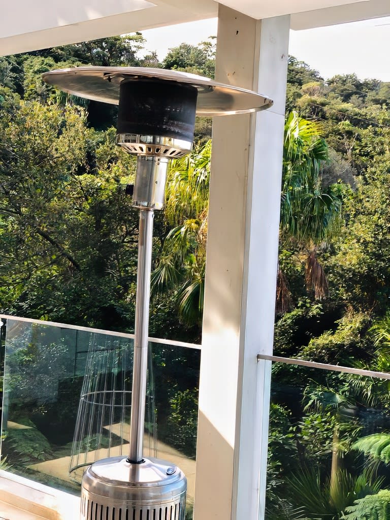 A balcony overlooking a forest with 6 x Mushroom Heaters, complete with Gas Bottles.