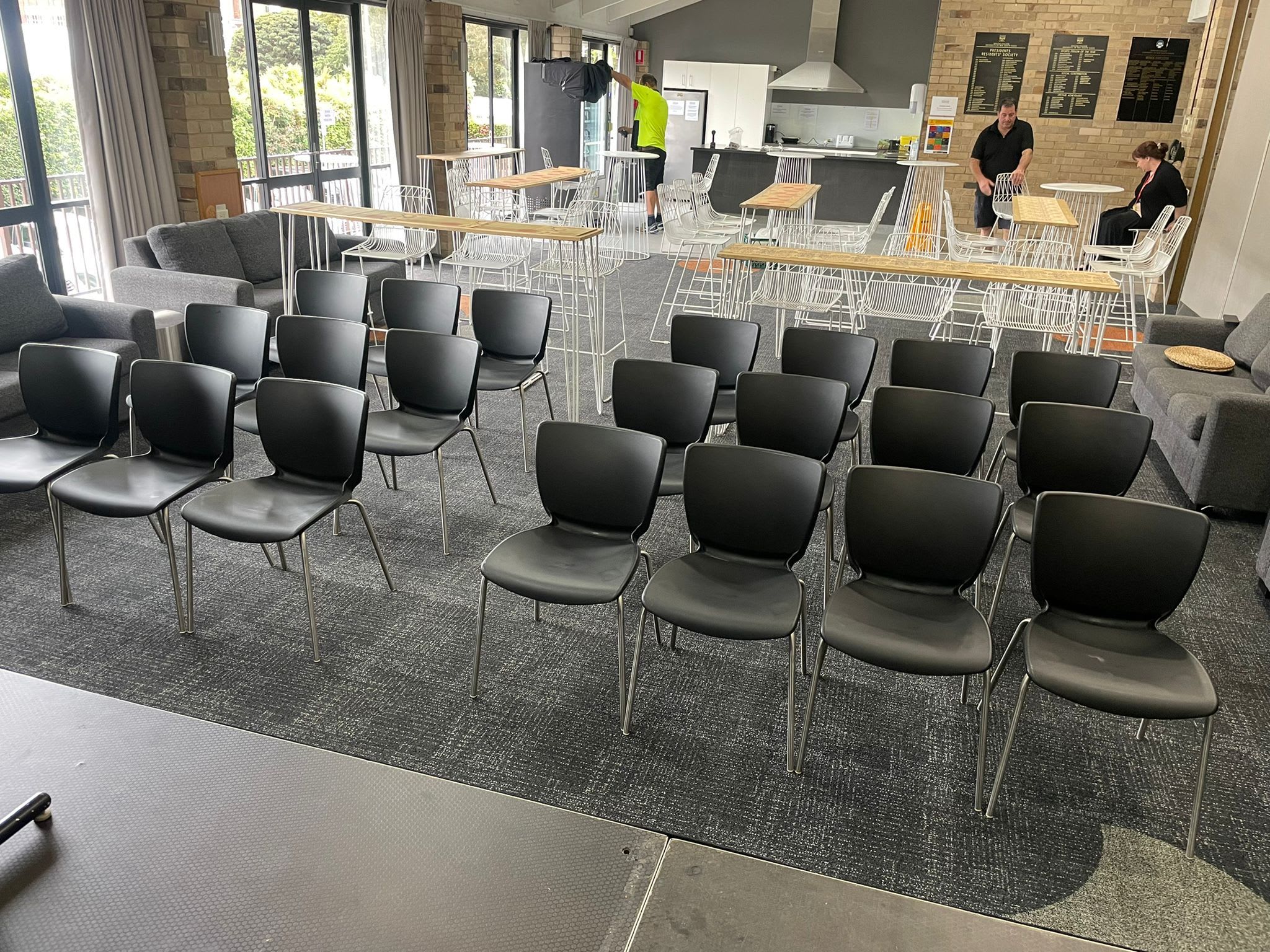 A conference room filled with black executive chairs.