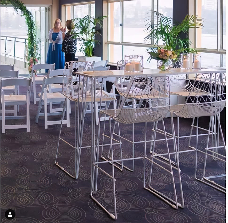 A white table and chairs in a room.