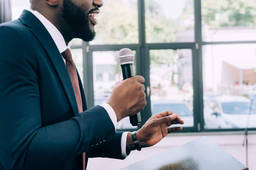 Man speaking through wireless microphone