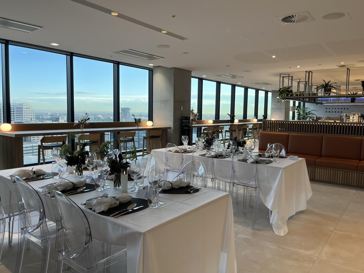 A restaurant with a stunning view of the city, offering Victorian Ghost Chair Hire for a unique dining experience.