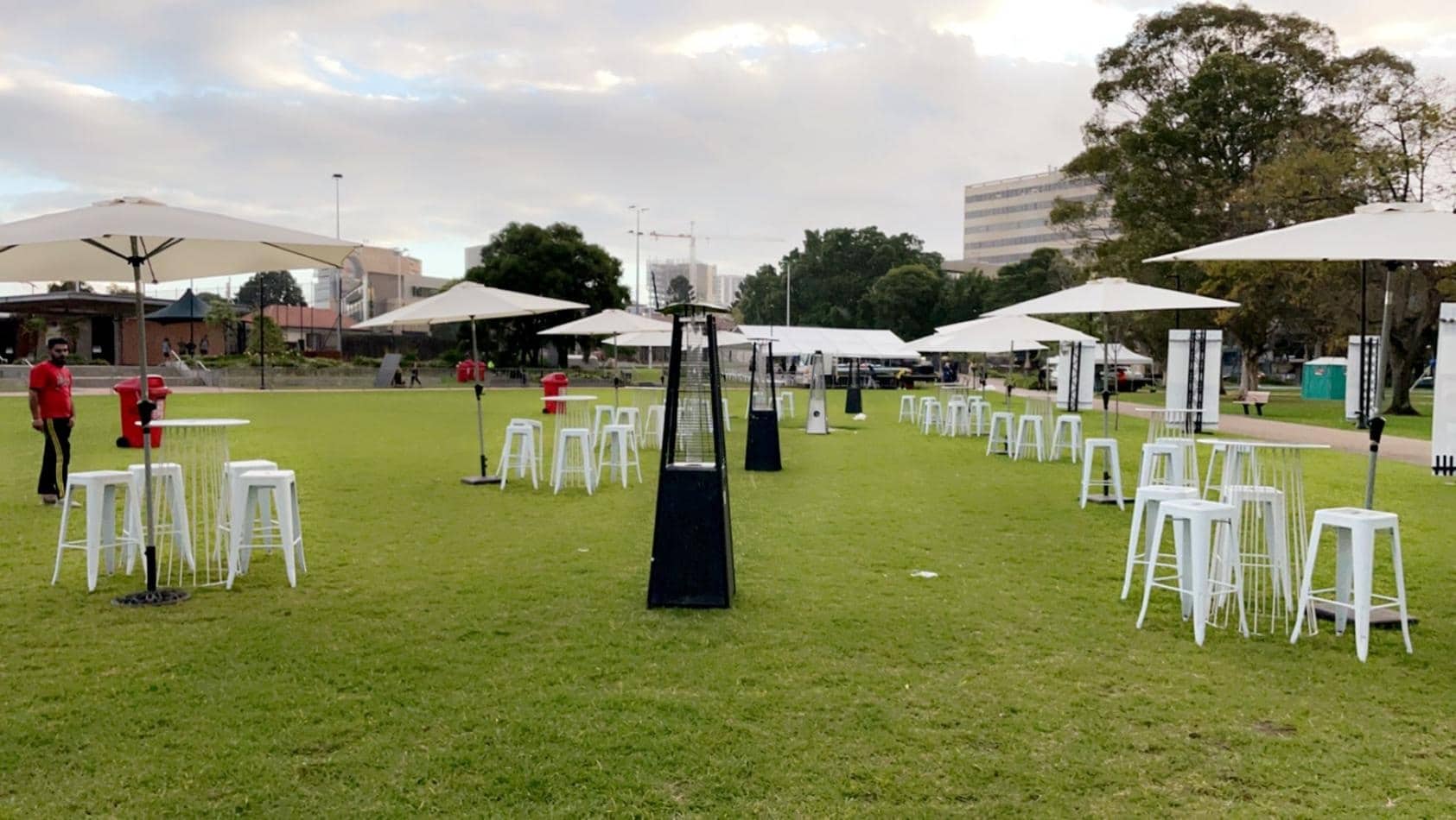 White table and chairs on a grassy area available for Tolix stool hire.