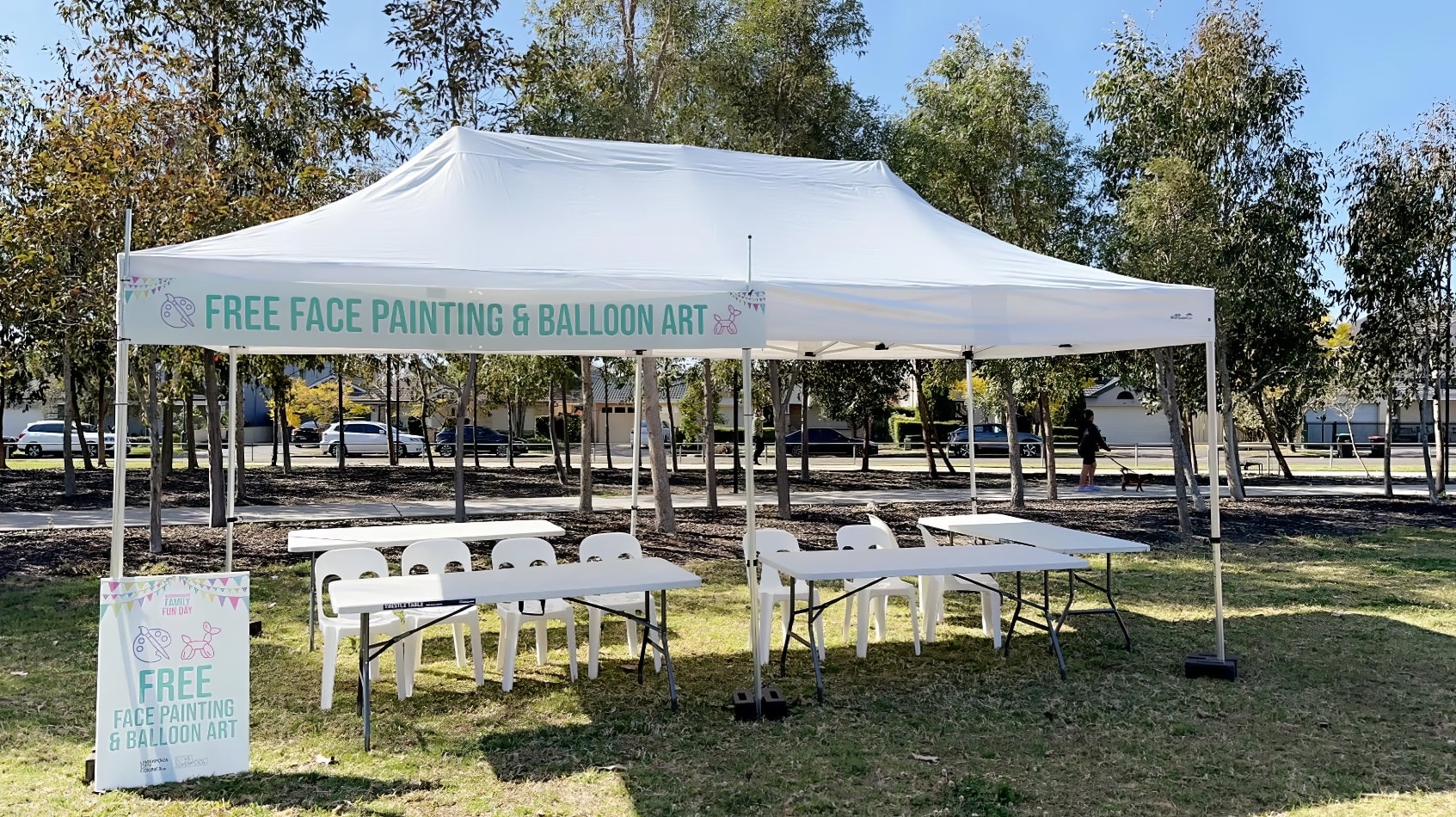 The park is adorned with a 3mx6m white tent, filled with tables and chairs for gatherings.