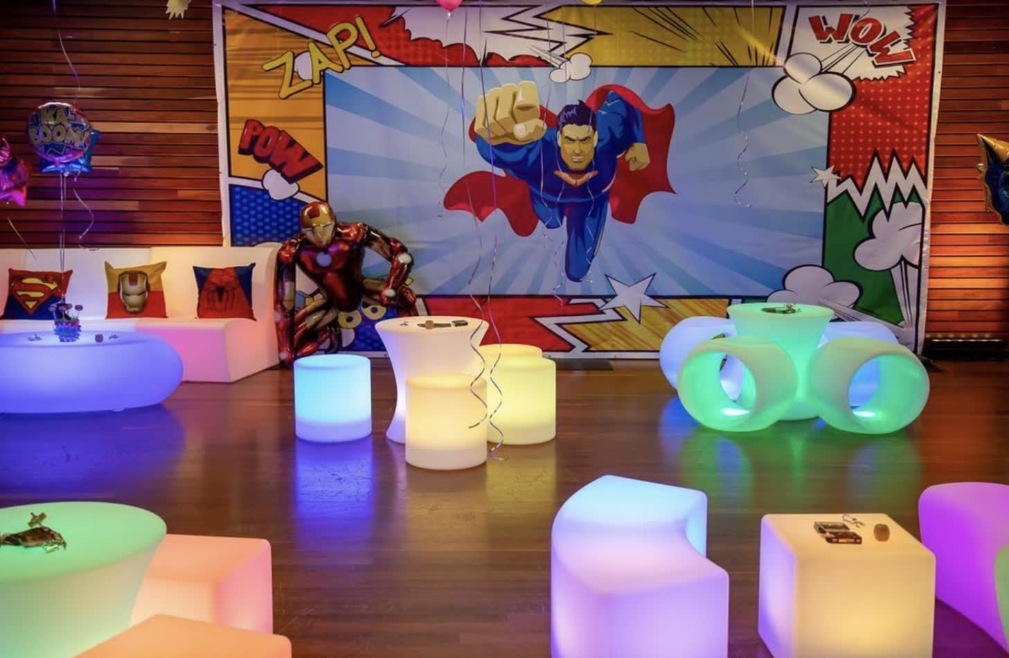 "Superman themed birthday party with Glow Cylinder seating hire.