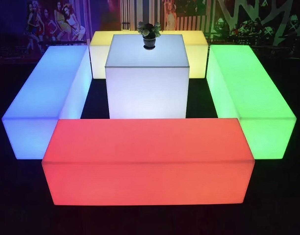 A set of colorful LED cubes glowing in a dark room.